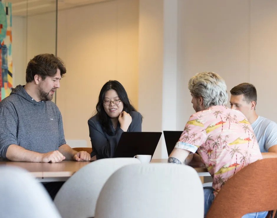 Evolve team talking to each other in their office